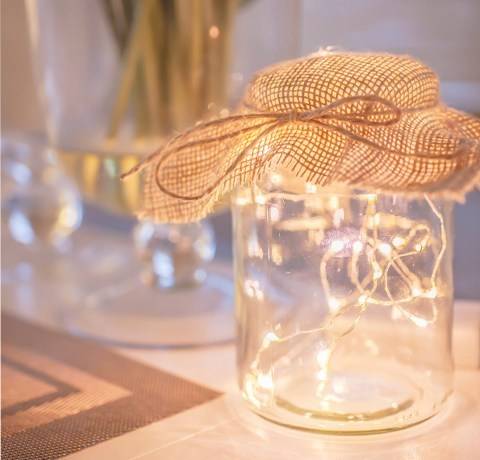 Fairy lights in mason deals jars with flowers