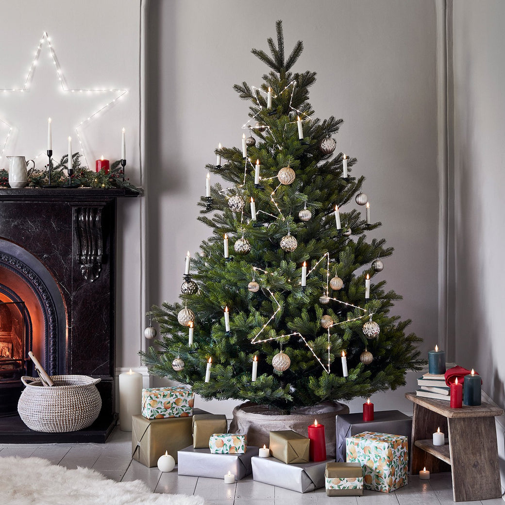 Christmas Tree Illuminated With Star Lights Baubles & Candles