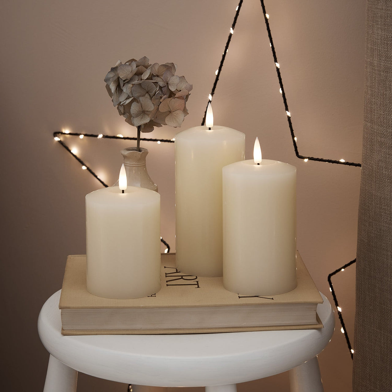 CA18013_truglow-led-pillar-candle-trio--white-stool_1_2000x2000_311cd375-2e86-4bce-a259-292bf9cdd839.jpg