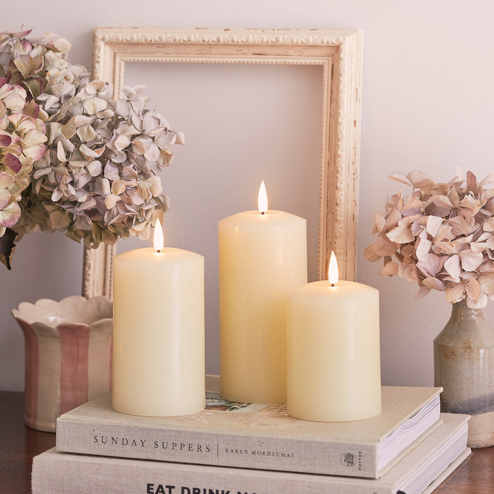 CA18013_truglow-led-pillar-candle-trio-white-books.jpg