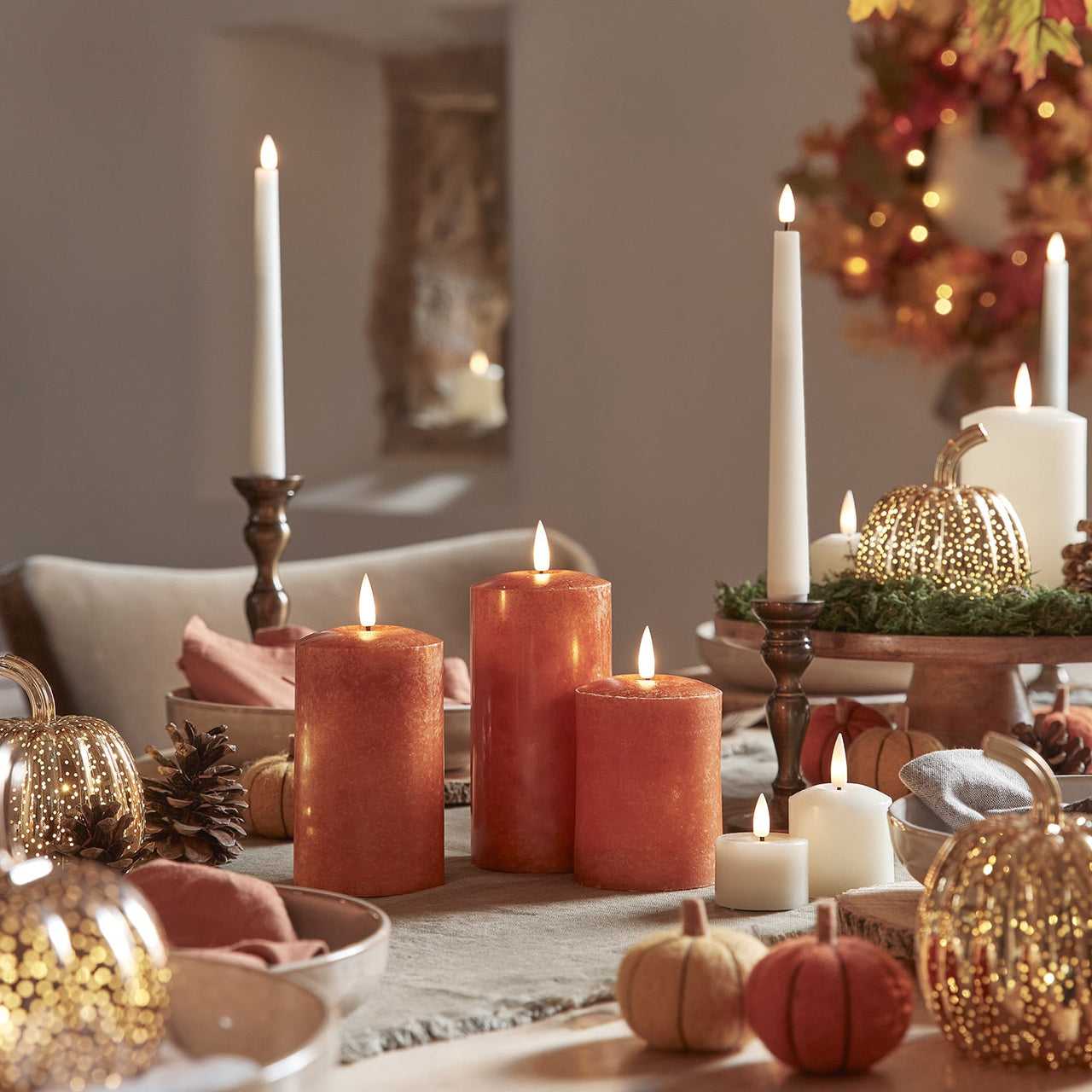 CA20013_TruGlow_-Mottled-Orange-LED-Autumn-Candle-Trio-Dining-Setting.jpg