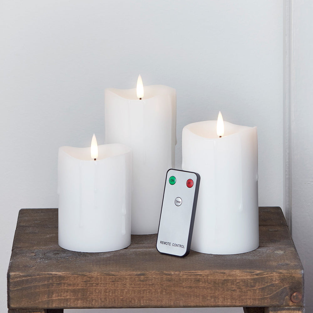 CA22002RC_TruGlow_-White-Dripping-Wax-LED-Pillar-Candle-Trio-Remote_1.jpg