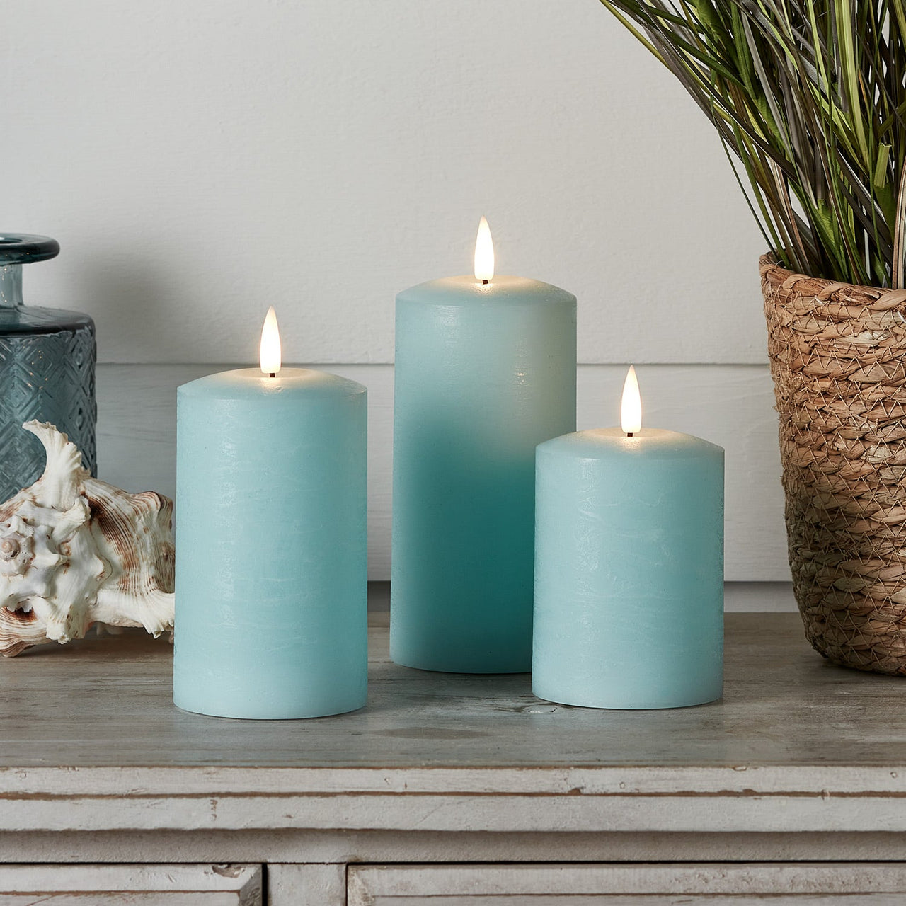 CA22020RC_TruGlow_-Blue-Distressed-LED-Pillar-Candle-Trio.jpg