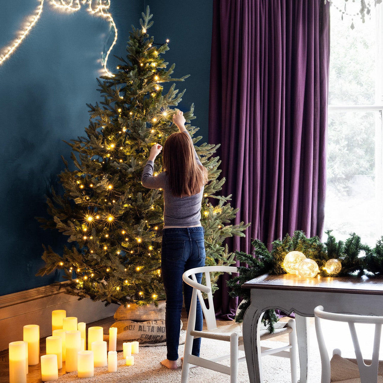 CC1-YW_Indoor-Christmas-Lights-On-Artificial-Tree-With-Girl-Living-Room-1_P6.jpg