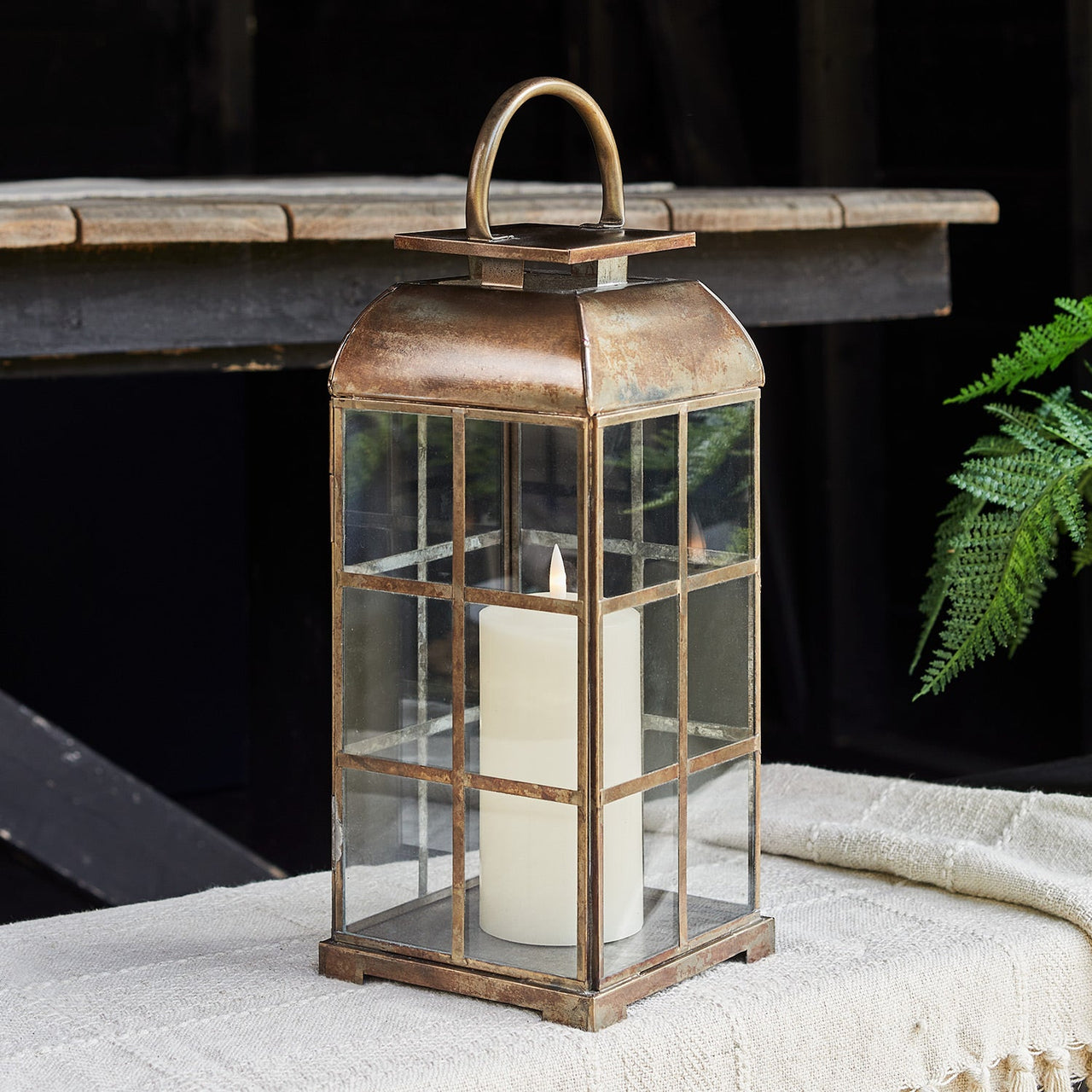 D-LA22017_Large-Brass-Indoor-TruGlow_-Candle-Lantern-Outside.jpg