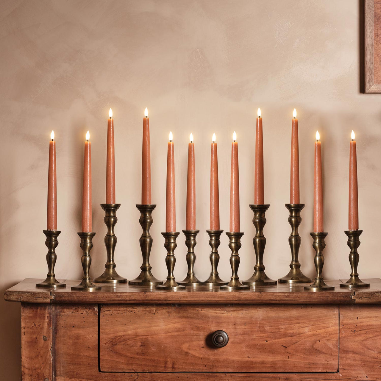 12 TruGlow® Distressed Orange LED Taper Candles