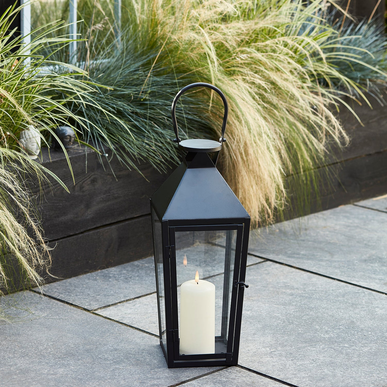 LA20021_medium-black-metal-lantern-truglow-outdoor-patio-p1_51633b34-9577-4c15-9ca9-395435dfefdb.jpg