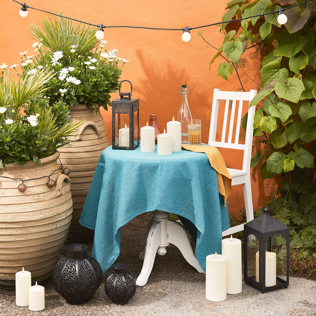 LA21004_Patio-Setting-Table-Garden-Lanterns-TruGlow-Candles-Festoons.jpg