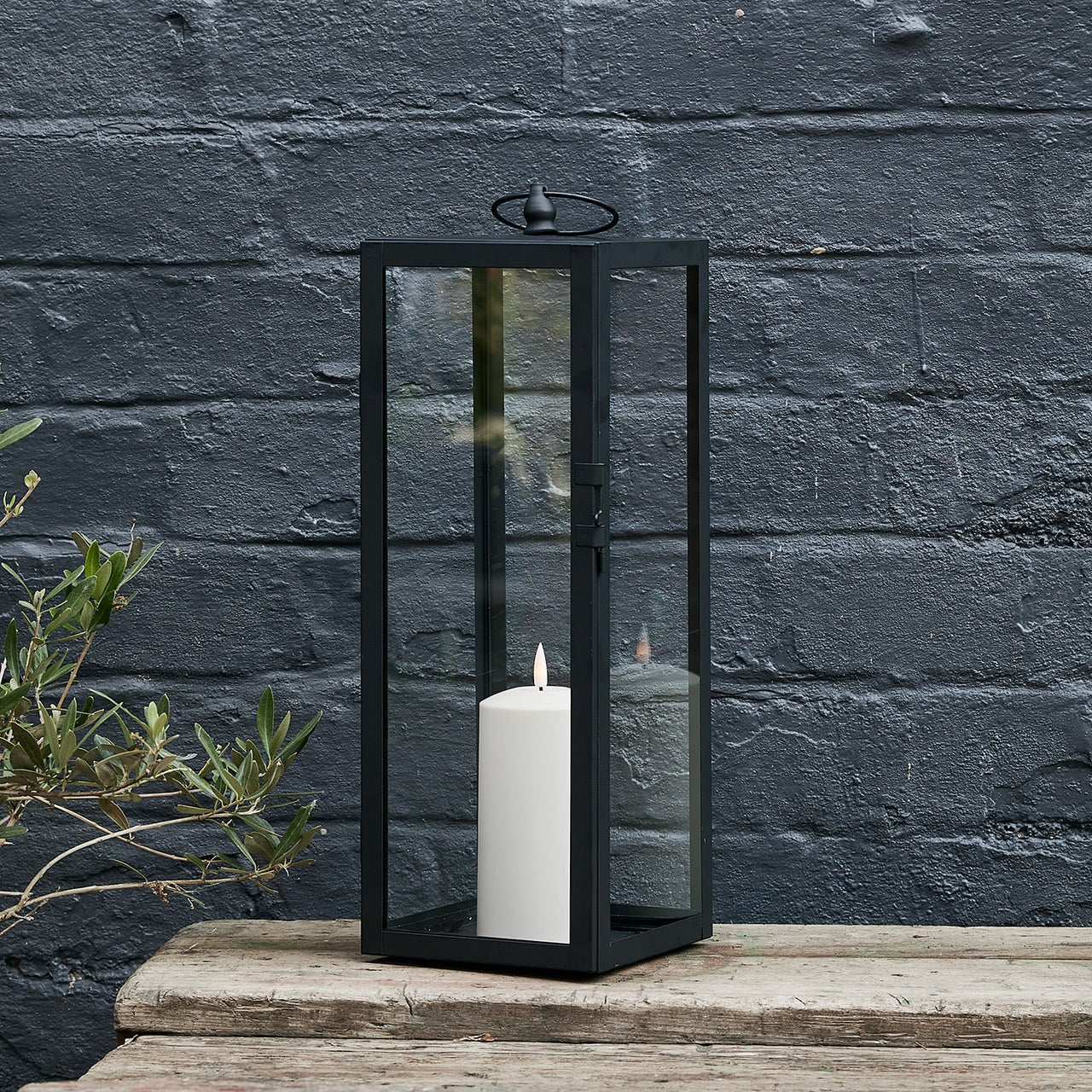 LA22013_Bowen-Large-Black-Garden-Lantern-with-TruGlow_-Candle-Black-Wall.jpg