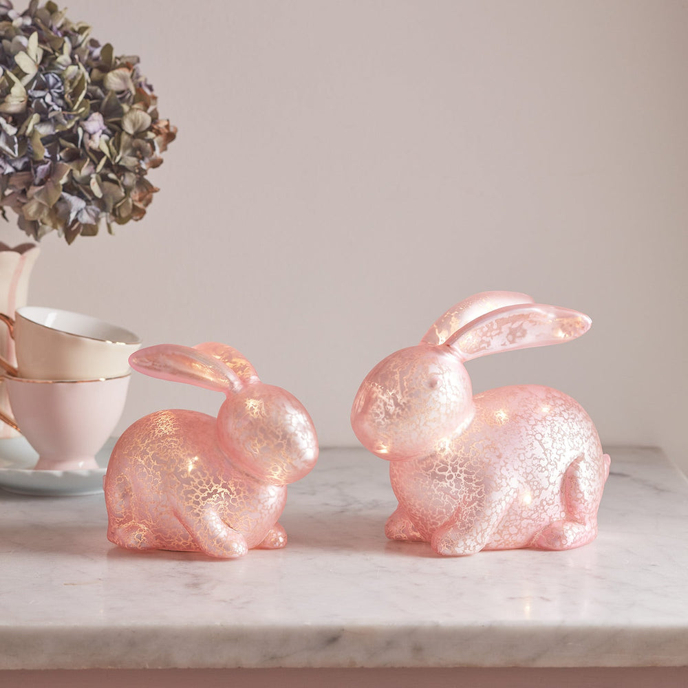 LL23002_Set-of-2-Pastel-Pink-Glass-Bunnies-shelf.jpg