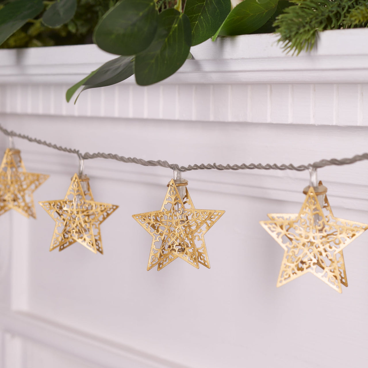 PL21073_16-Gold-Filigree-Star-Fairy-Lights-Mantle-Off.jpg