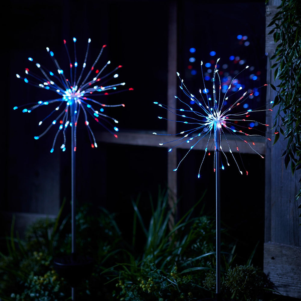 SL21022_Red-White-Blue-Solar-Starburst-Stake-Lights-Illuminated-Yard.jpg