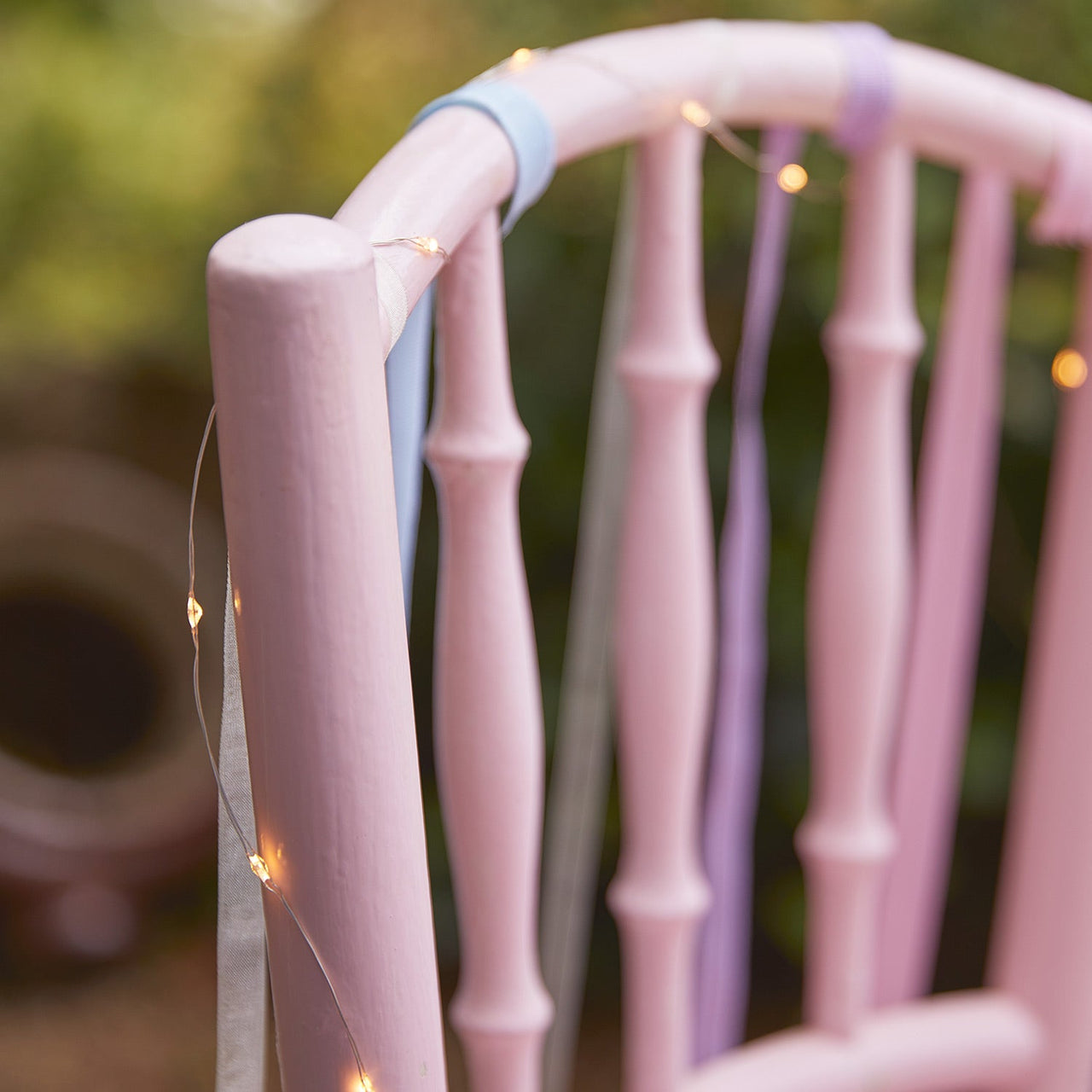 Tea-party-chair-pastel-fairy-lights-garden.jpg