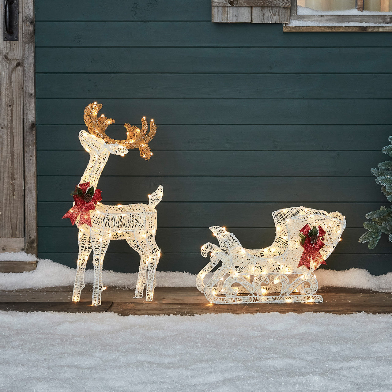 XX2006_1~Outdoor-Christmas-Figures-Light-Up-Reindeer-Sleigh-Cabin.jpg