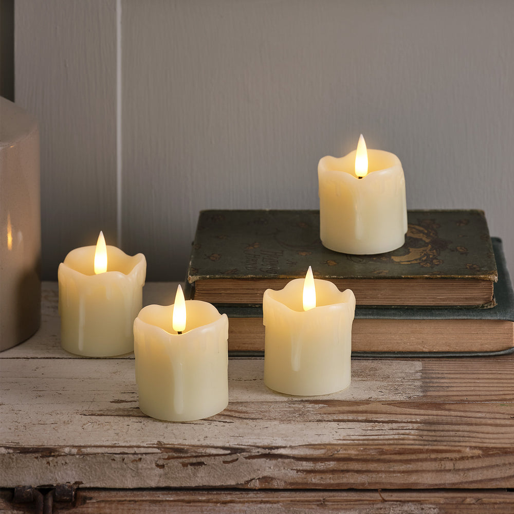 4 TruGlow® Dripping Wax LED Votive Candles